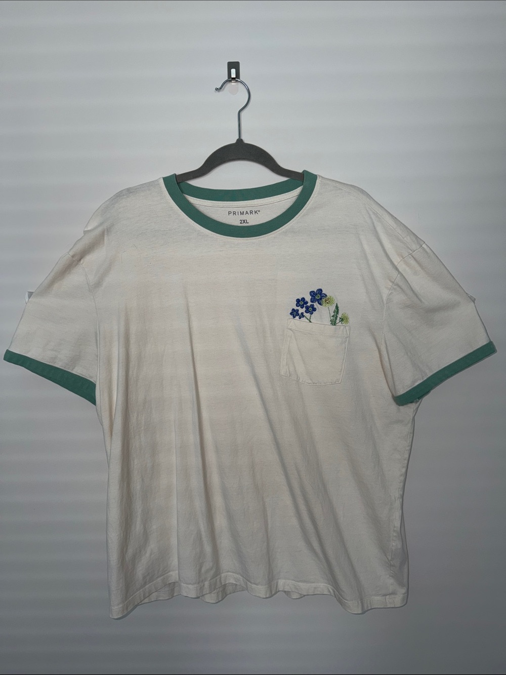 Primark Cream Short-Sleeve Tee with Green Trim and Blue Floral Pocket